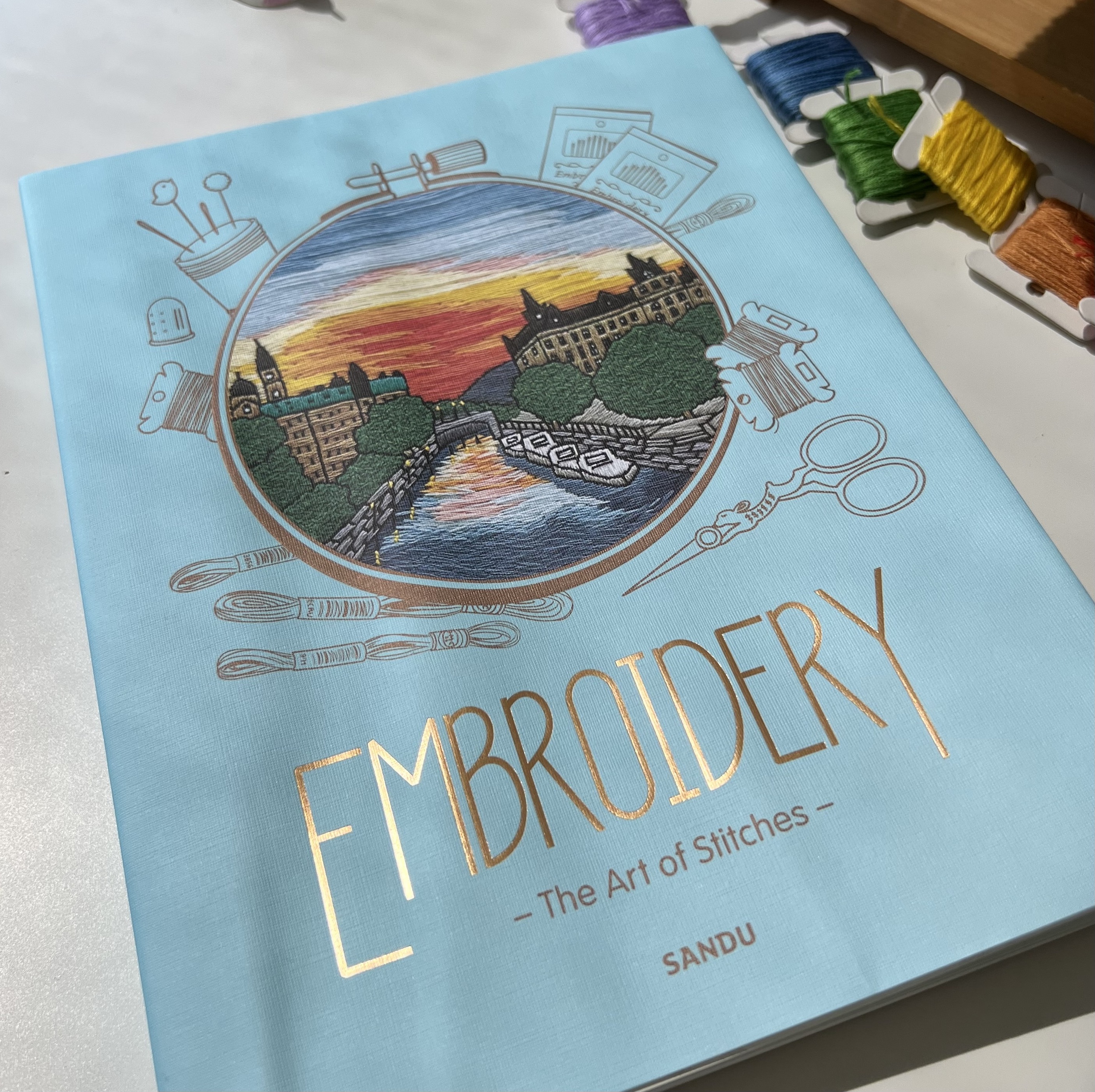 Cover of the book "Embroidery: Art of stitches" with Kseniia's embroidery on the cover