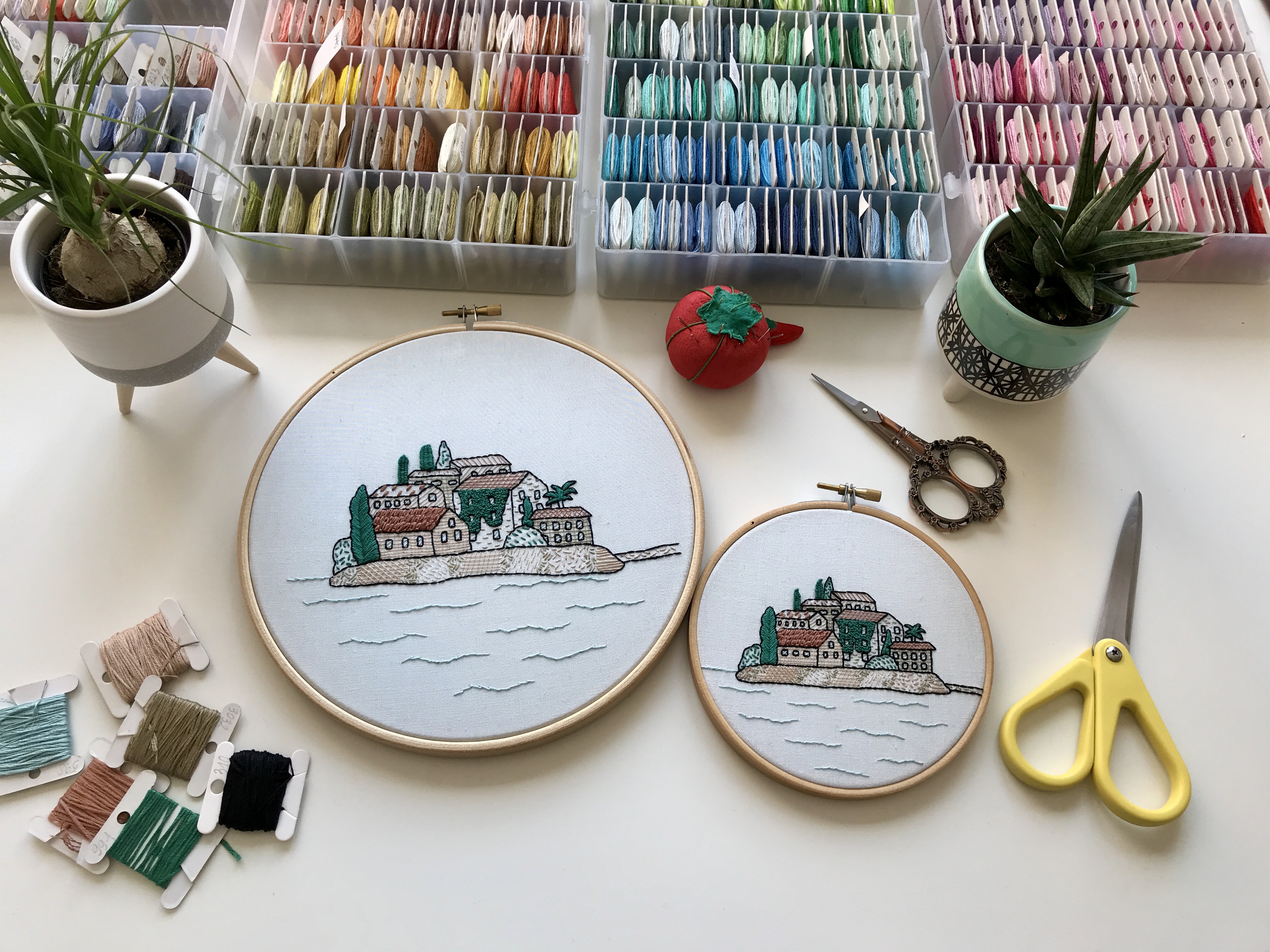 Architectural embroidery Sveti Stefan. Two embroideries with an island, houses and greenery